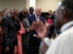 President Biden bows his head as the Rev. Dr. Jamey O. Graham Sr. speaks at St. John Baptist Church in Columbia, S.C., on Jan. 28.