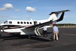 PacifiCorp executives board the company plane at Portland International Airport.