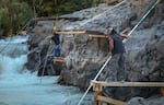Tribal fishermen use dip nets to fish from platforms at Lyle Falls. Platforms are maintained and improved by the fishermen throughout the year.