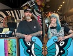 Brian Wilson, left, and Olivia Britz-Wheat, right, at Mortal Emblem tattoo studio in Portland, Ore., on May 16, 2025. The pair are the cofounders of the Void Tattoo Fest which aims to celebrate diversity and center the artists themselves.