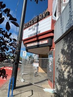 Chain-link fencing can be seen in front of the Roseway Theater in Northeast Portland.