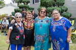Elida Sifuentez (far right) poses with friends during the Fiesta Mexicana Parade in Woodburn, Oregon on Aug. 16, 2025.