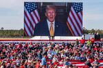 A video plays as supporters arrives to hear former President Donald Trump speak at a campaign rally at Kinston Jet Center on Nov. 3, 2024, in Kinston, N.C.