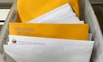 A stack of paper medical claims piling up in the Salem, Ore., business office of Oregon Specialty Group. The cancer care provider had to revert to paper billing following a cyberattack that disrupted billions in payments nationwide.