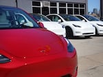 Tesla cars sit on a lot in Chicago on March 28, 2022. A $7,500 tax credit for purchasers of new electric vehicles is changing again after the U.S. unveiled new guidelines that will impact the list of car models that qualify.