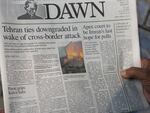 A Pakistani reads the front page of a morning newspaper covering Iran's strike, at a stall in Islamabad, Pakistan, Thursday, Jan. 18, 2024.