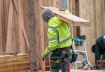 Construction at a group of homes on Southeast Harold Street near Southeast 122nd Avenue, in Portland, April 12, 2023. Justin Wood’s company is developing the site, and focuses on building new homes for people living at or below median income levels. 