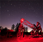 This photo, which was obtained from the Carlton Observatory, shows Forrest Babcock with the “Big Blue Telescope" in 2019.