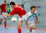 Paul Osborne of England battles for the ball with Abduraimov Azamat of Usbekistan during the 2003 World 5s Futsal Championship between England and Usbekistan JUNE 5 2003 at the Bukit Jalil Putra Stadium in Kuala Lumpur, Malaysia.