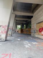 The walls, floors and pillars of downtown Portland's Mark O. Hatfield U.S. Courthouse are covered in anti-police graffiti, but there was almost no litter to be found early the afternoon of Sunday, June 14. About a half dozen volunteers, including children, wore gloves and masks as they picked up trash.