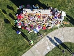 Mourners visit a makeshift memorial at Silver Rail Elementary School on Oct. 16, 2026, in Bend, Ore.