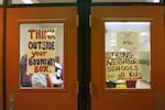 Parents posted signs on the doors of Roseway Heights K-8 school, for visitors to see as they attended a meeting on Nov. 18, 2015, about Portland Public Schools' proposed boundary and building changes.