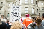 People, many carrying signs bearing messages opposing white supremacists groups, attend the Portland Solidarity with Charlottesville vigil at Portland City Hall Sunday, Aug. 13, 2017.