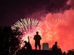 Fireworks are a staple of the Fourth of July and other holidays, but they can frighten animals and pets. Here, spectators at the World War II Memorial watch Independence Day fireworks in Washington, D.C., in 2020.