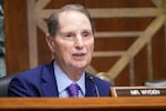 FILE - Sen. Ron Wyden, D-Ore., questions U.S. Trade Representative Jamieson Greer as he testifies before the Senate Finance Committee on Capitol Hill in Washington, Tuesday, April 8, 2025.