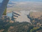 An aerial photo of the Symbiosis Festival on private land in the middle of the Ochoco National Forest.