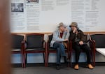 People chat in the hallway at the Asian Health and Service Center in Portland, Ore., on May 21, 2026.