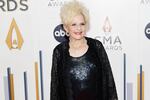 Brenda Lee attends the CMA Awards at Nashville's Bridgestone Arena on Nov. 8. Her holiday hit "Rockin' Around the Christmas Tree" has reached No. 1 on the Billboard Hot 100, 65 years after its debut.