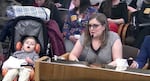 Nikki Monaco and her son Emmett present to a public hearing in Salem.
“If we had screened him at birth, we could have treated him at birth and he would have had a much better outcome," said Monaco.