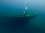 A diver explores Grecian shipwreck at Thunder Bay National Marine Sanctuary.