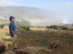 Tom Calvanese peers out at the rocky coastline from behind the Oregon State University Field Station in Port Orford, Ore., on the southern Oregon Coast.