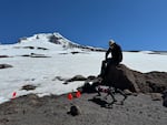 Dan Koditschek, with the University of Pennsylvania, watches Spirit the robot as it walks from rocks to snow on Mount Hood.