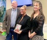 Randy Zuber, left, and his wife Rebecca, right, stand with Jennifer Massey, on Jan. 2, 2025 at St. Helens City Hall, where Jennifer Massey was sworn in as mayor.