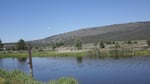 An agricultural valley near Klamath Falls. The drastic elevation change exemplified in the distance is necessary for pumped storage hydroelectricity projects.