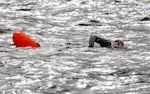 Peyton Scott in the Columbia River, attempting to complete the Swim Across the Columbia challenge, a five-mile swim from Knappton, Wash., to Astoria, Ore., Aug 11, 2024. Scott had not swum regularly since she was a child, and only began regularly training for this event a few months ago. 