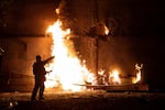 A Ukrainian firefighter responds to a drone strike in the northeastern city of Kharkiv on Thursday. Both sides have ramped up drone attacks. Russia has fired more than 400 drones at Ukraine on two separate nights in the past week, the largest numbers in the war.