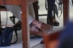 Luigi Mangione's feet are seen manacled at a hearing for the murder of United Healthcare CEO Brian Thompson at Manhattan Criminal Court.
