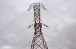 FILE--In this Feb. 10, 2010, file photo, power lines from Bonneville Dam are shown in North Bonneville, Wash. The Bonneville Power Administration has scrapped its controversial plan to build a high-voltage transmission line near Portland, Oregon.