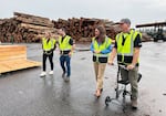 Jamie Herrera Beutler, center, tours Canyon Lumber in Everett on September 27, 2024. She was campaigning in her run for Commissioner of Public Lands. To her right is the company's log buyer, Jake Hambidge.