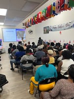 In late June, Haitians in the U.S. with Temporary Protected Status attended an information session at the Haitian Bridge Alliance, in San Diego, about what the loss of their legal status could mean for them and their families — and how to prepare.