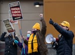 Members of UFCW Local 555 demonstrate outside of a Portland Fred Meyer store in 2021. The union is attempting to recall state Rep. Paul Holvey, D-Eugene.