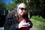 Teresa Christian uses a phone app designed to help her experience the eclipse on Aug. 21 2017.