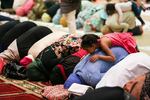 Women pray at the Muslim Educational Trust in Tigard, Oregon, during Ramadan. Fear is not a new feeling for many in communities of color in Portland, but the knife attack on a MAX train has amplified it — especially for Oregon Muslim communities.