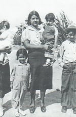 Carolyn Garcia's tía, or auntie, Maclovia holds children in a treasured family photo.