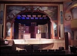 The OK Theater's renovation includes embellishments by woodcarver Steve Arment, and murals by painter Anna Vogel.