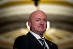 Sen. Mark Kelly waits to speak during a news conference at the U.S. Capitol in 2023.