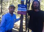William Fisher, left, of Salmon, Idaho, and Jamey Landin, of Burns, have pledged to guard the unofficial memorial for Robert "LaVoy" Finicum until agencies agree to allow a permanent site.