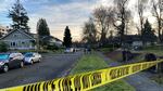 Police tape blocks a street near Washington's Capitol Campus where a person was shot Saturday as far right and far left protesters clashed.