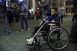 A travel weary Mustafa Abed arrives in Portland for medical attention. His leg was severed near the hip in a U.S. missile strike in Fallujah when he was two.