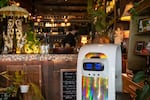 Robot host at Top Burmese restaurant in Beaverton, Oregon, stands ready to help welcome customers, Aug. 23, 2021. 