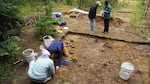 The archaeology team finishing pedestaling, or revealing artifacts in place for documentation, at the Maxville excavation site. This was the first time that a Black logging family home in rural Oregon has been excavated.