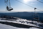 The chair lift sits empty above irregularly patchy snow conditions before Mt. Hood Meadows opens for its second to last weekend in Mount Hood, Ore., on April 4, 2026. The ski resort is closing weeks early this season after an abnormally warm and low snowpack winter.