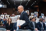 FILE - With protesters in the audience, Boeing CEO Dave Calhoun arrives at a Senate subcommittee hearing to answer to lawmakers about troubles at the aircraft manufacturer. Ike Riffel , a California father whose two sons, died in 2019 when a Boeing 737 Max jetliner crashed in Ethiopia, fears that instead of putting Boeing on trial, the government will offer the company another shot at corporate probation through a legal document called a deferred prosecution agreement, or DPA.