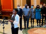 The CROWN Act, an acronym meaning "Creating a Respectful and Open World for Natural Hair," would add hairstyle and texture to a provision in the Minnesota Human Rights Act that prohibits racial discrimination in housing, employment and education, among other areas. Here, Rep. Esther Agbaje, D-Minneapolis, speaks to reporters outside of the House chamber in St. Paul on Feb. 28, 2022.