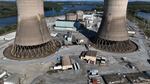 The shuttered Three Mile Island nuclear power plant stands in the middle of the Susquehanna River on October 10, 2024. One of the plant's two reactors partly melted down in 1979, but the second one operated for decades before it was closed. It is now set to be restarted as early as 2028, pending approval by the Nuclear Regulatory Commission.