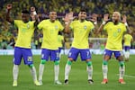 Neymar of Brazil (right) celebrates with Raphinha, Lucas Paqueta and Vinicius Junior after scoring a goal during the round of 16 match between Brazil and South Korea on December 05, 2022.